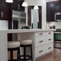 Yorkshire door style in Maple finished in Java and the Cantum door style in Thermofoil in White